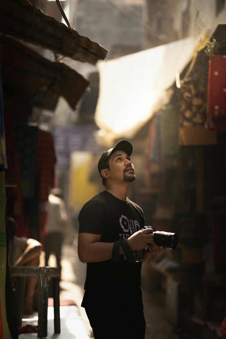 A photographer exploring an urban street market, capturing the essence of local culture and colors.